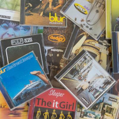 FBB8D3 A pile of CDs showing some of the main groups behind the 90s Britpop movement